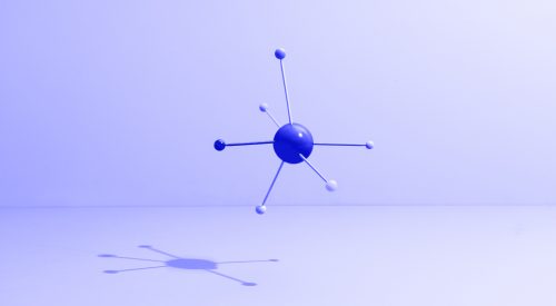 Conceptual still life with colored sticks attached to a sphere, symbolizing teamwork